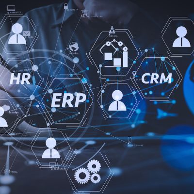 Architecture of ERP (Enterprise Resource Planning) system with connections between business intelligence (BI), production, CRM modules and HR diagram.businessman hand working with modern digital tablet computer.